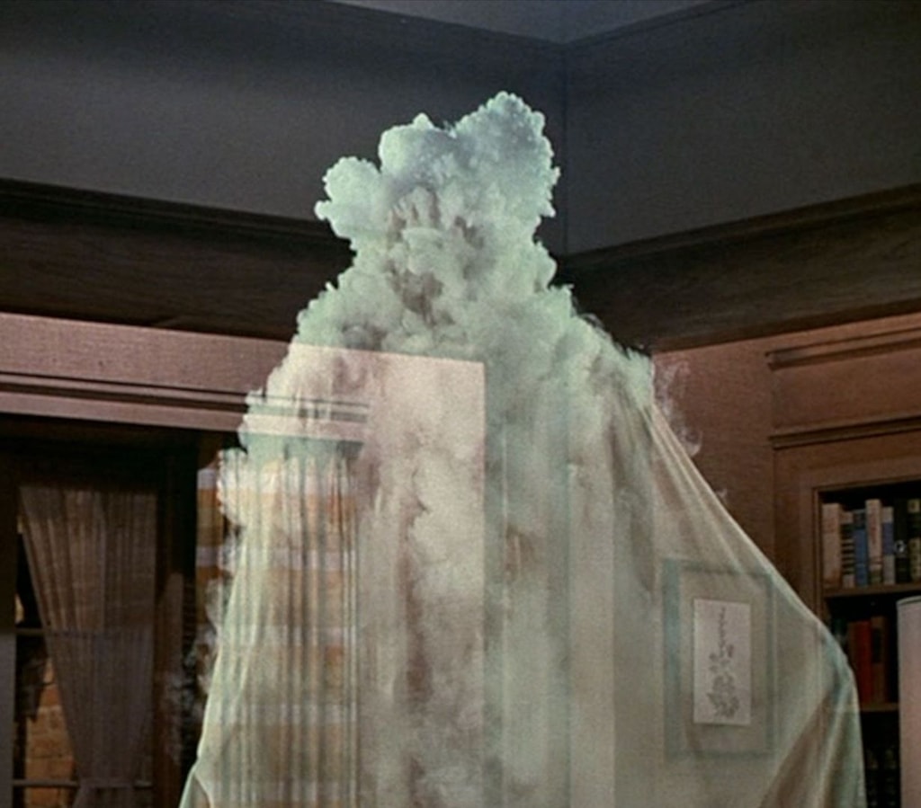 A ghostly figure engulfed in smoke, with a library visible in the background.
