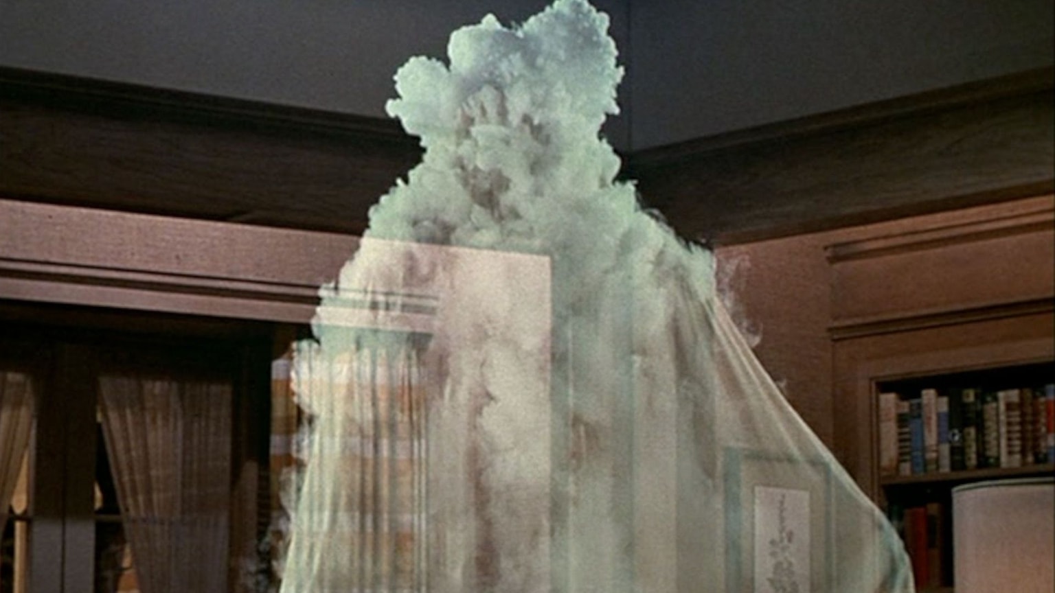 A ghostly figure engulfed in smoke, with a library visible in the background.